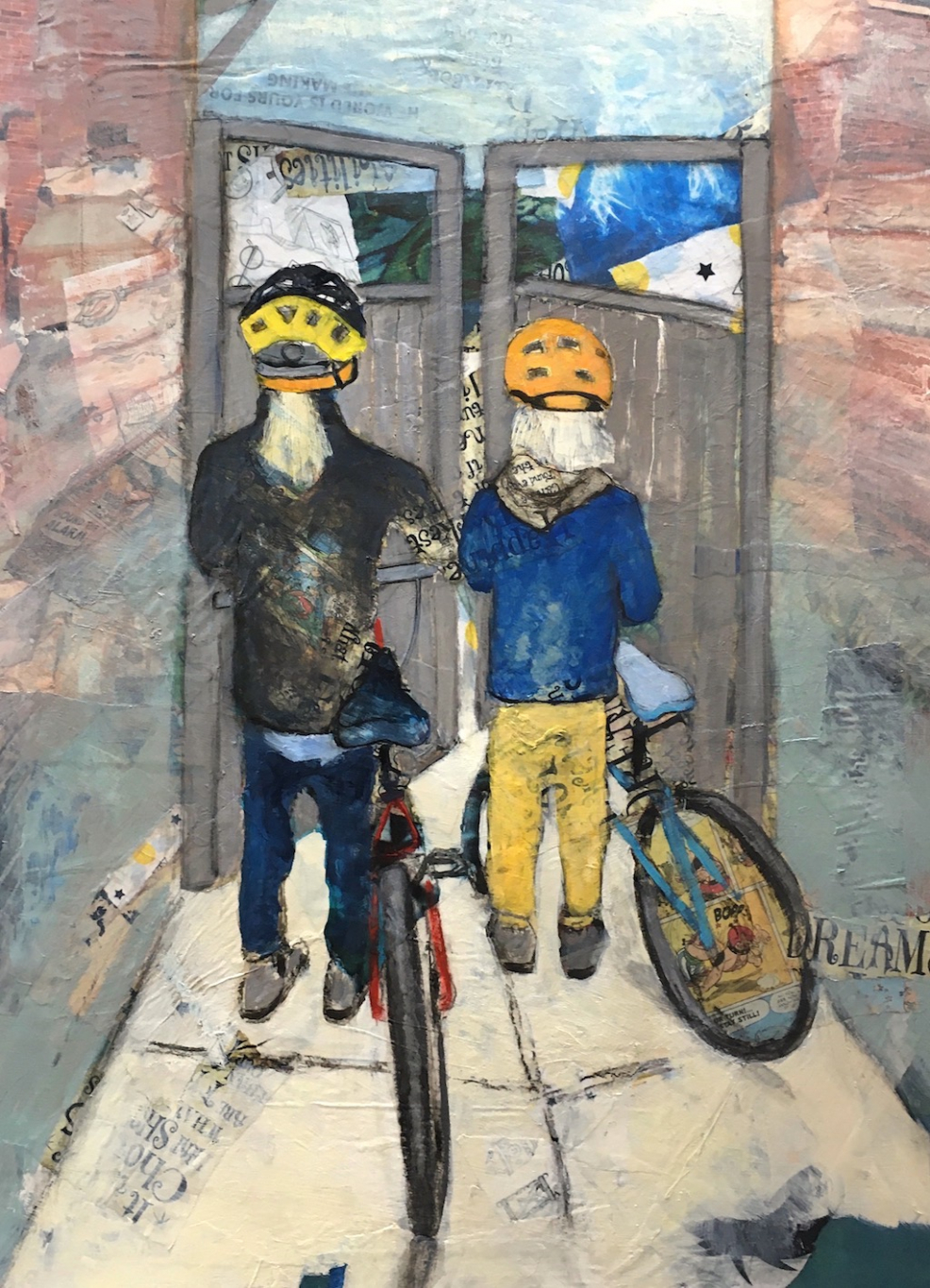 Two boys heading out of their yard with their bicycles.