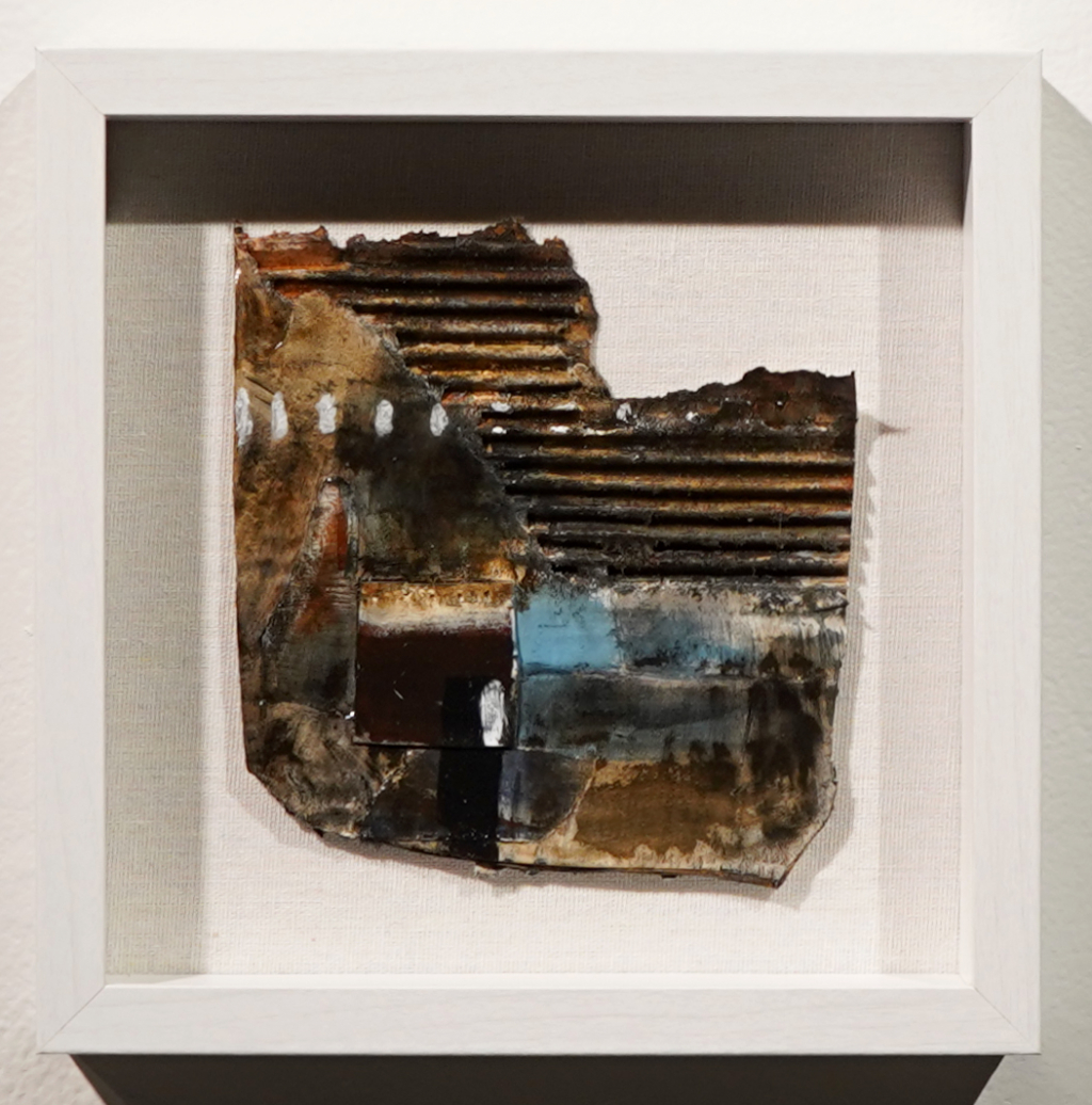 This small abstract makes use of recycled materials like cardboard to form the foundation for its textural composition.
