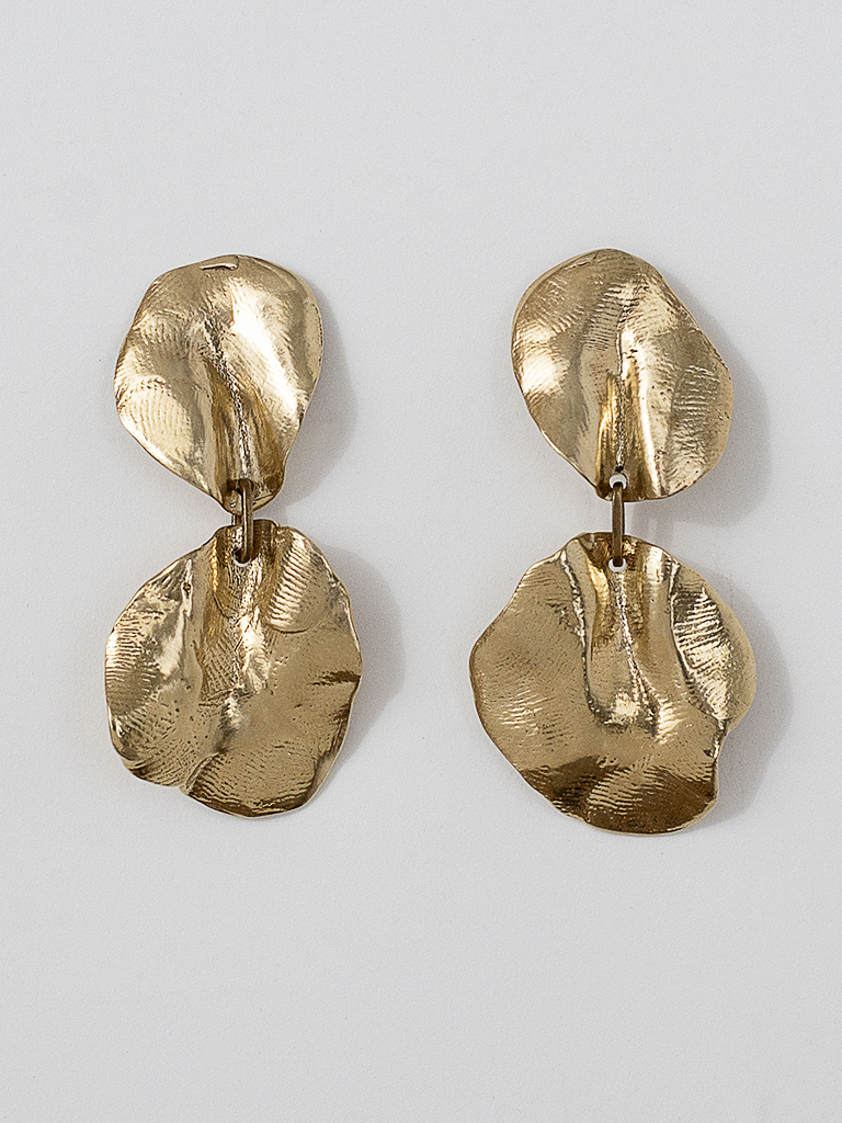 Brass statement earrings made from two organically sculpted large petals attached together by a small brass ring
