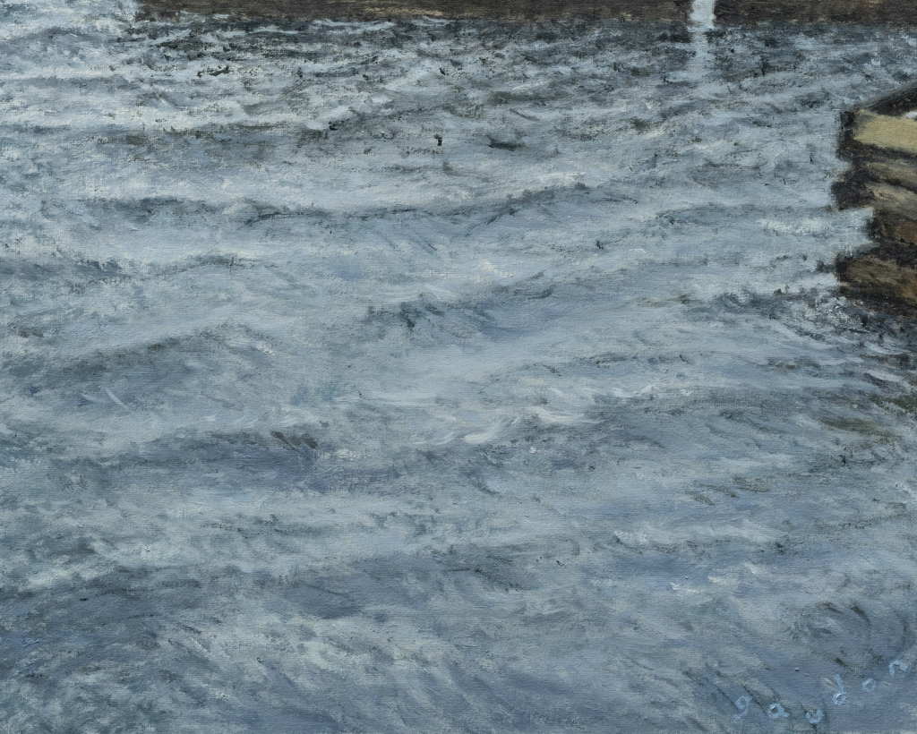 Grey ocean waves around 2 wharfs.